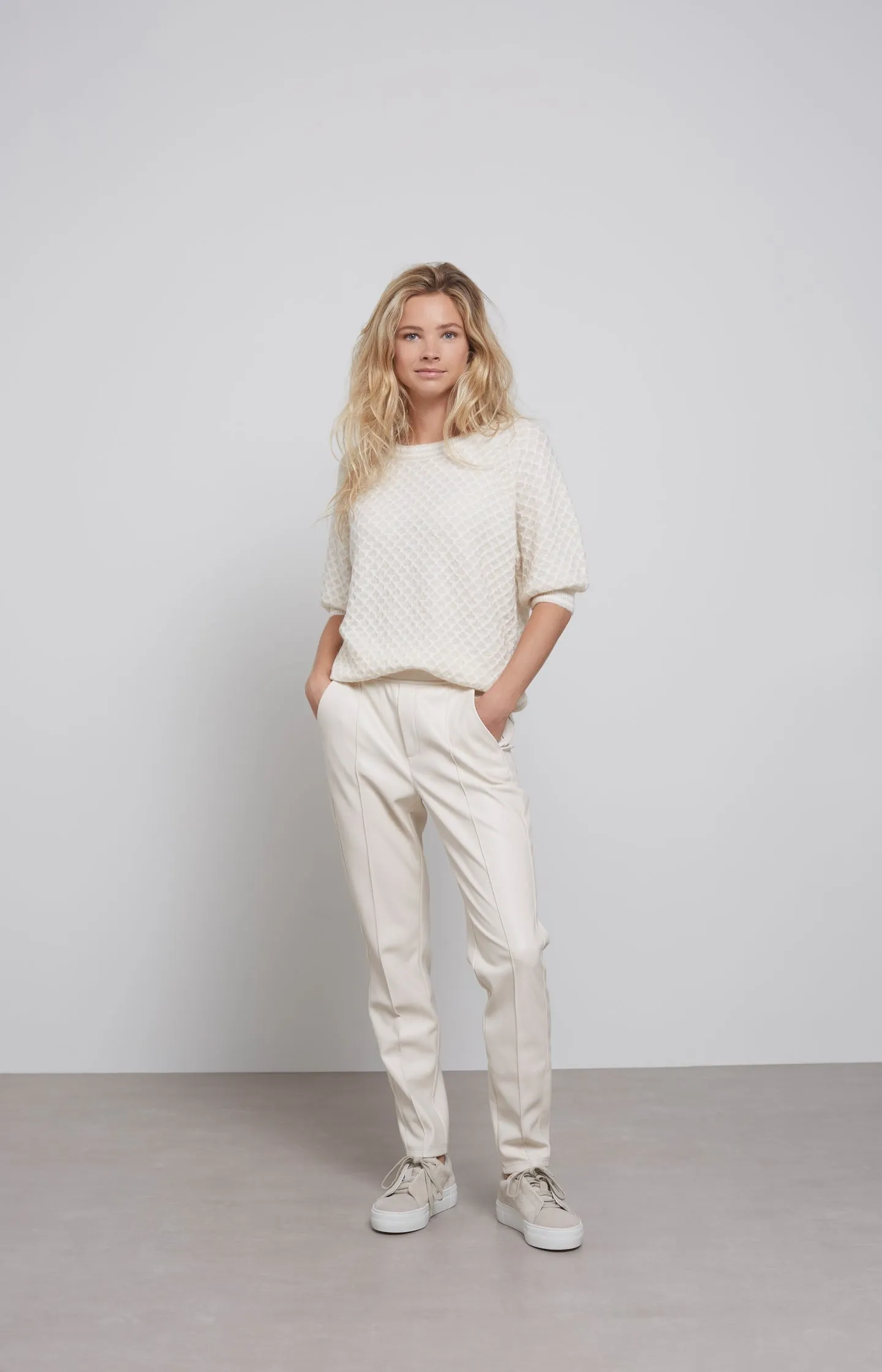 Faux leather trousers with side pockets and seam details